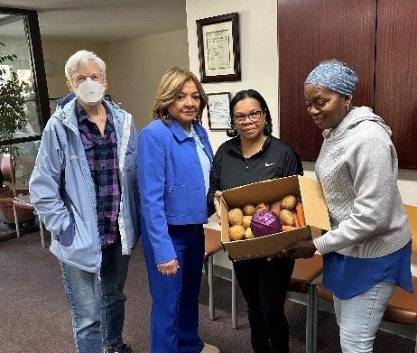 ACSGW Client Services Team Show the Veggie Box Content